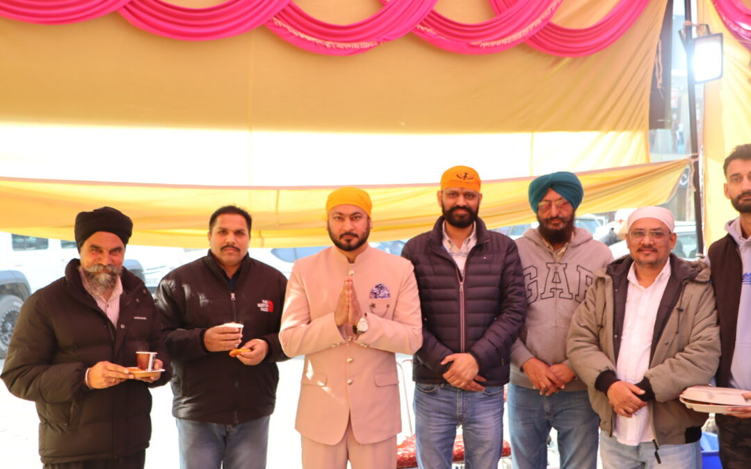 Langar Seva by Career Creators Members of Career Creators participating in Langar Seva, standing together under a decorated tent, wearing traditional head coverings and serving food with unity, respect, and community spirit.